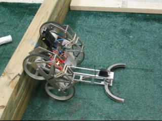 Wall Climbing Robot with Arm